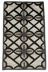 Hand-tufted beige rug with bold black lattice pattern.